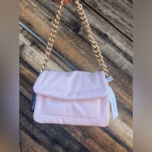 Marc Jacob’s pillow bag with a bracelet